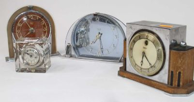 A Smiths Sectric Art Deco mantel clock, having a clear and blue glass case, applied chapter ring