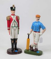 A painted cast iron model of a soldier, h.40cm; together with another of a cricketer