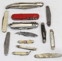 A collection of various folding pocket knives