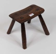 A 19th century provincial elm milking stool, h.20cm