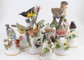 A collection of ten Japanese bisque porcelain models of birds, the largest h.20cm