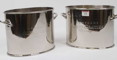 A pair of polished metal wine coolers, of twin handled oval form, h.17cm