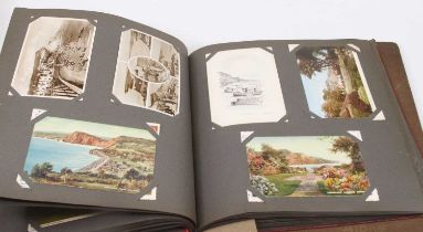 Two vintage postcard albums and contents, to include portrait, topographical and novelty examples