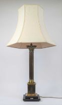 A brass Corinthian column table lamp, mounted to an ebonised stepped wooden plinth, h.70cm (