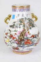 A Chinese porcelain vase of Hu shape, enamel decorated with deer within a landscape, bearing four