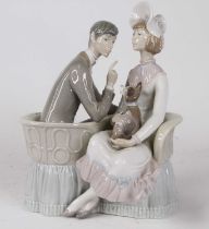 A Lladro porcelain figure group of a couple upon a conversation seat with a dog, h.26cm Gentleman