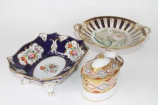 A 19th century continental porcelain comport, hand-painted with flowers to the centre within blue