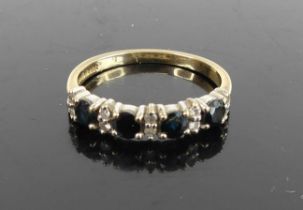 A 9ct gold, sapphire and diamond point set half hoop ring, 2.2g, size P