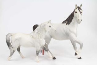 A Royal Doulton model of a Welsh mare, h.16.5cm; together with another Royal Doulton model of a