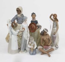 A Lladro porcelain figure of a lady holding a lamb, h.27cm; together with five Nao figures and one