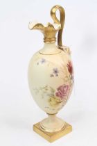 A Royal Worcester blush ivory ewer, decorated with flowers, puce mark to the underside, h.27cm