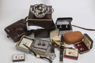 A collection of miscellaneous items, to include a mantel clock, vintage SLR camera, wristwatches,