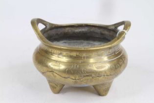 A Chinese brass tripod censer, decorated with a phoenix, w.13cm