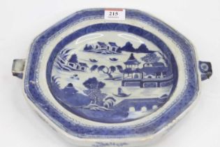 A Chinese blue and white porcelain warming plate, decorated with a mountain landscape with