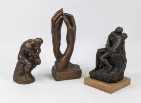 A bronzed plaster figure of The Thinker, h.23cm; together with another of an embracing couple; and