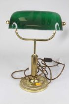 An early 20th century style brass banker's desk lamp, having a green glass shade, height 34cm