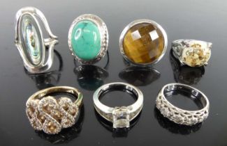 A collection of modern silver and white metal semi-precious and paste set dress rings (7)