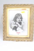 Late 19th century English school - portrait of a young girl holding a kitten, charcoal on porcelain,