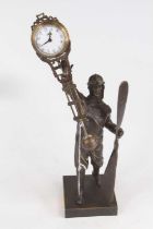 A figural Aviator bronzed mystery clock, h.38cm