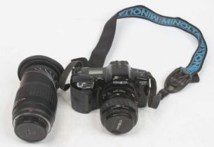 A Minolta Dynax 3XI digital camera; together with a Sigma 20-200mm lens