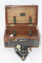 A mid-20th century Stanley theodolite, the tube with rack and pinion action and bubble level, on
