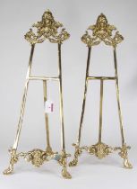 A pair of brass table top easels, in the rococo style, height 53cm