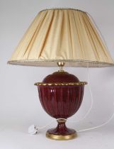 A red and gilt glazed pottery table lamp in the form of an urn, h.33cm (excluding fittings) Requires