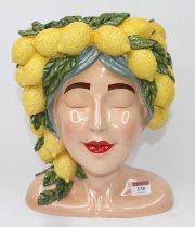 A novelty composite vase in the form of a head and shoulders bust of a lady, the head bearing a