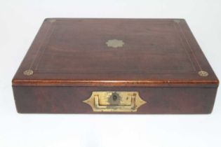 A mid-19th century mahogany and brass inlaid writing box, of typical hinged rectangular form,