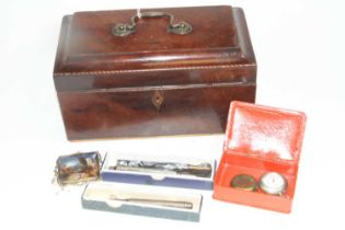 A George III mahogany tea caddy containing a Victorian silver propelling pencil, having engine