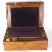 A Victorian walnut writing slope, of typical hinged rectangular form, opening to reveal a fitted