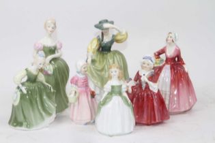 A Royal Doulton porcelain figure of a lady 'Buttercup', h.18cm; together with six others to