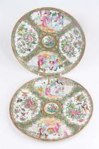 A near pair of Chinese Canton porcelain plates, 19th century, each decorated with alternating panels