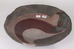 Christa Maria Herrmann (b. 1945) - A large ceramic Raku bowl, of shallow form, crackle glazed with