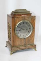 A George IV rosewood cased mantel clock, of rectangular shape, the silvered dial with Roman