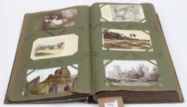 A vintage postcard album and contents, primarily topographical and architectural