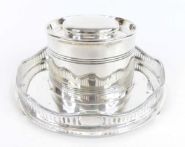 A circa 1900 silver capstan inkwell, the cylindricial ring turned body having hinged domed cover and