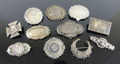 A selection of Victorian and later silver brooches, to include elliptical and oval examples, gross