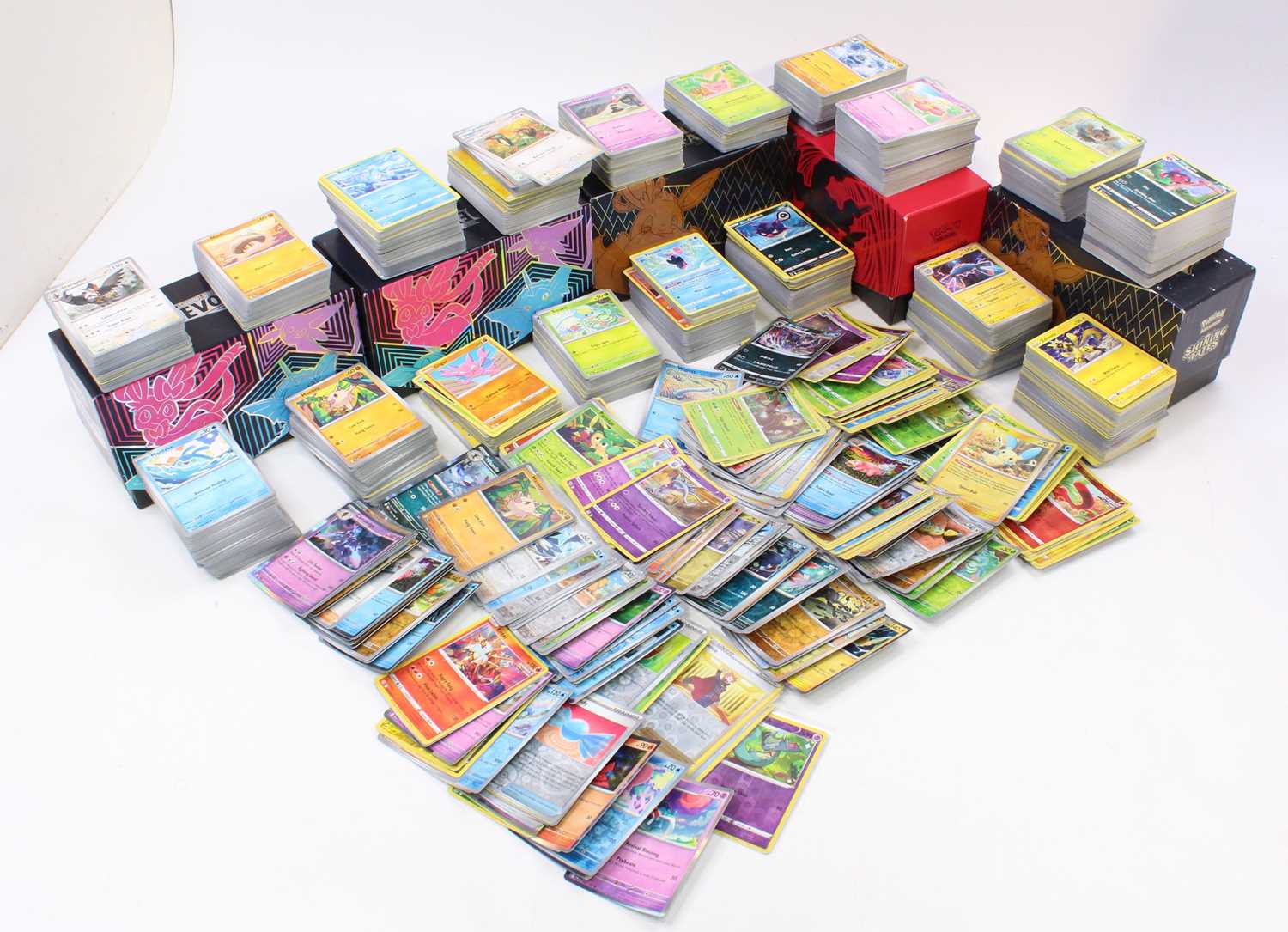 Five Pokemon Elite Trainer Boxes containing a large quantity of holographic, reverse and non-holo