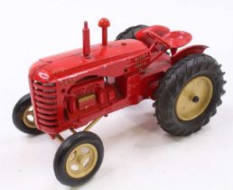 A Moko No. 745D Massey Harris tractor, larger scale example, comprising red body with tan wheels,