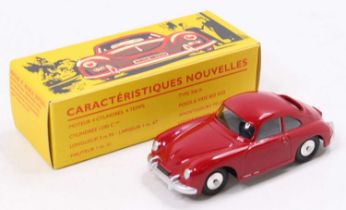 A Quiralu reproduction diecast and tinplate model of a Porsche 356A, comprising red body with