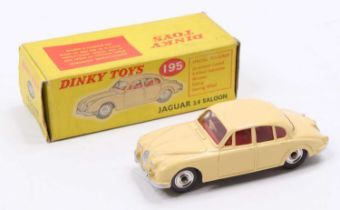 Dinky Toys No. 195 Jaguar 3.4 saloon comprising cream body with red interior and spun hubs, housed