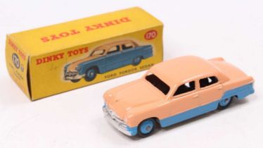 A Dinky Toys No. 170 Ford Fordor Sedan comprising of two tone pink and blue body with blue hubs,