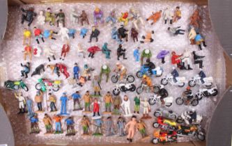 A large tray containing a quantity of plastic and diecast miniatures to include tractor, wagon, bike