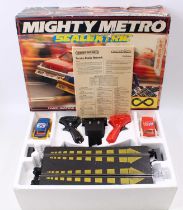 A Scalextric Mighty Metro set including track, two cars and hand throttle, in good clean condition