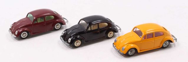 A collection of three various loose Techno No. 819 Volkswagen saloons, comprising orange body with