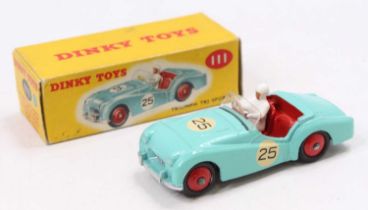 A Dinky Toys No. 111 Triumph TR2 Sport in turquoise body No. 25 with red interior, white driver