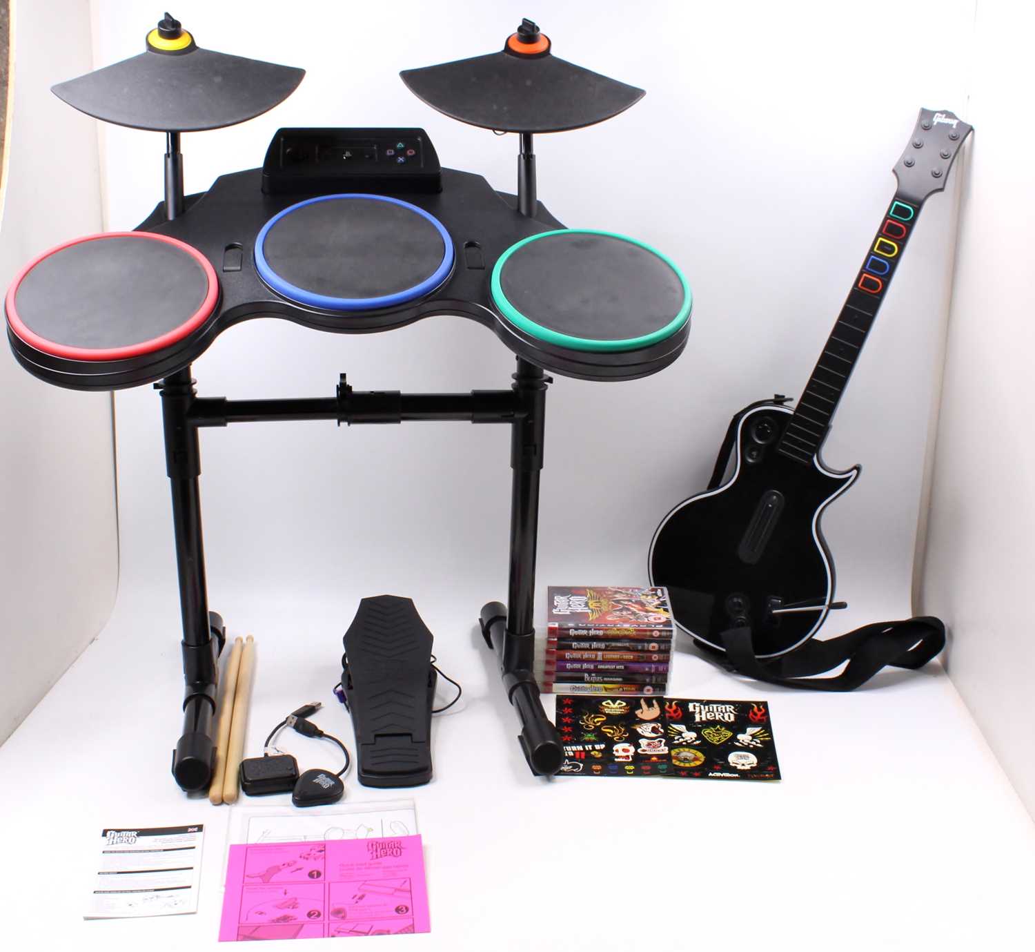 A Guitar Hero for Playstation 3 bundle to include Drum Kit, Les Paul, Foot pedal and drumsticks,