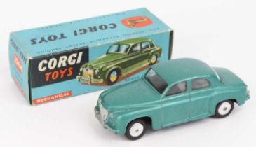 Corgi Toys No. 204M Rover 90 saloon comprising of a metallic blue-green body with spun hubs and