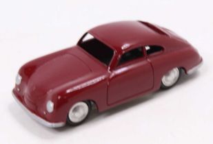 A Marklin No. 8004 model of a Porsche 356 comprising burgundy body with silver detailed headlights